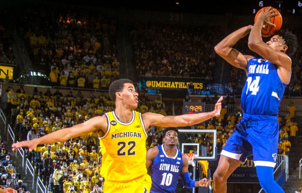 Caleb Houstan struggles to defend a Seton Hall shooter