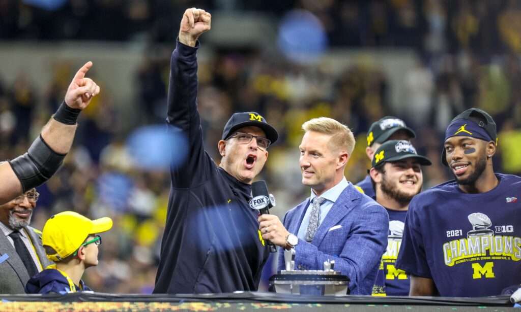 Jim Harbaugh celebrates the 2021 Big 10 Championship