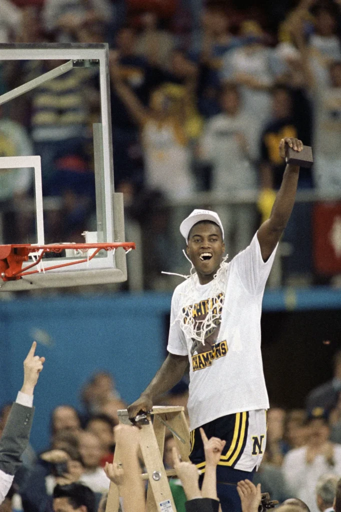 Glen Rice celebrates the 1989 college basketball national championship.