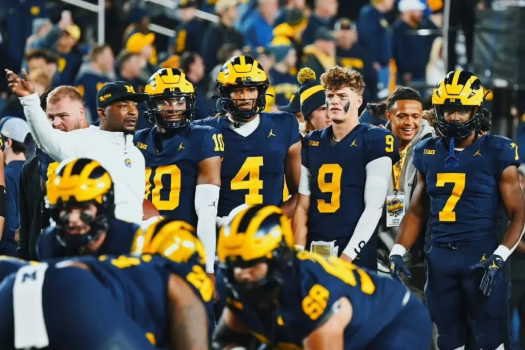 Michigan starters look on from the sidelines as Michigan dominates Purdue.