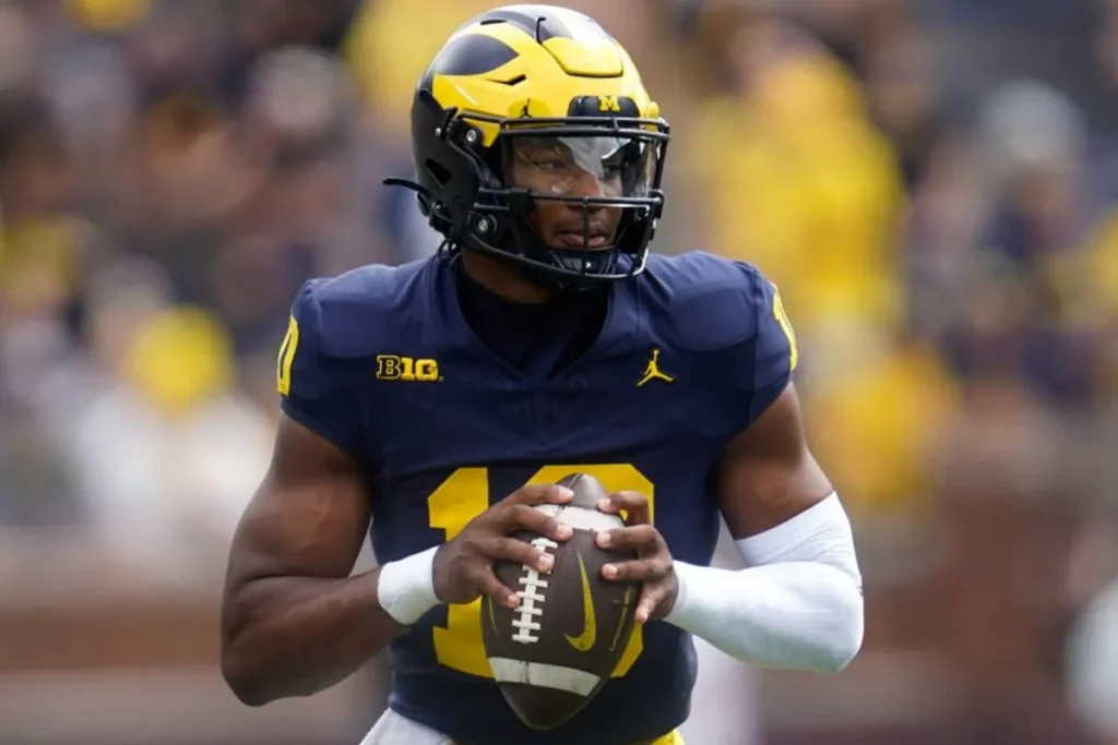 Alex Orji may be the most exciting athlete at Michigan since Denard Robinson, but questions remain about his throwing ability. Photo: Paul Sancya, AP.