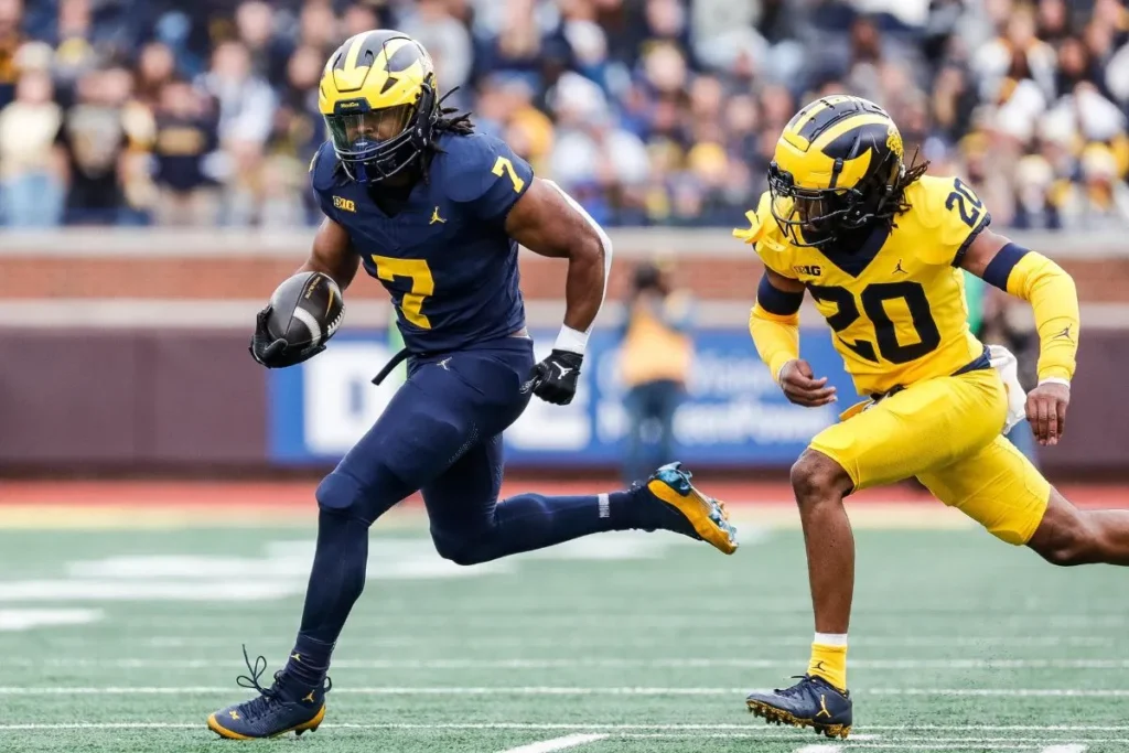 Jyaire Hill tracks down Donovan Edwards at the 2024 Michigan spring football game.